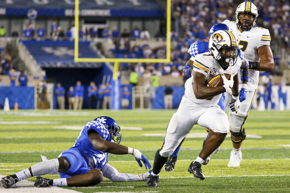 Missouri running back Tyler Badie (1) runs toward the end zone during the second half of an NCAA college football game against Kentucky in Lexington, Ky., Saturday, Sept. 11, 2021. (AP Photo/Michael Clubb)