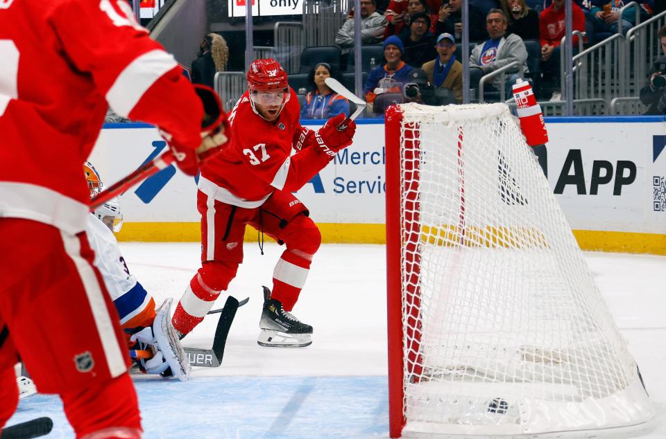 Red Wings forward J.T. Compher scores during the third period of the Wings' 4-3 overtime win on Monday, Oct. 30, 2023, in Elmont, New York.