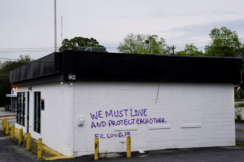 Graffiti with a positive message regarding coronavirus is seen on the side of a building days before the phased reopening of businesses from coronavirus disease rules in Atlanta