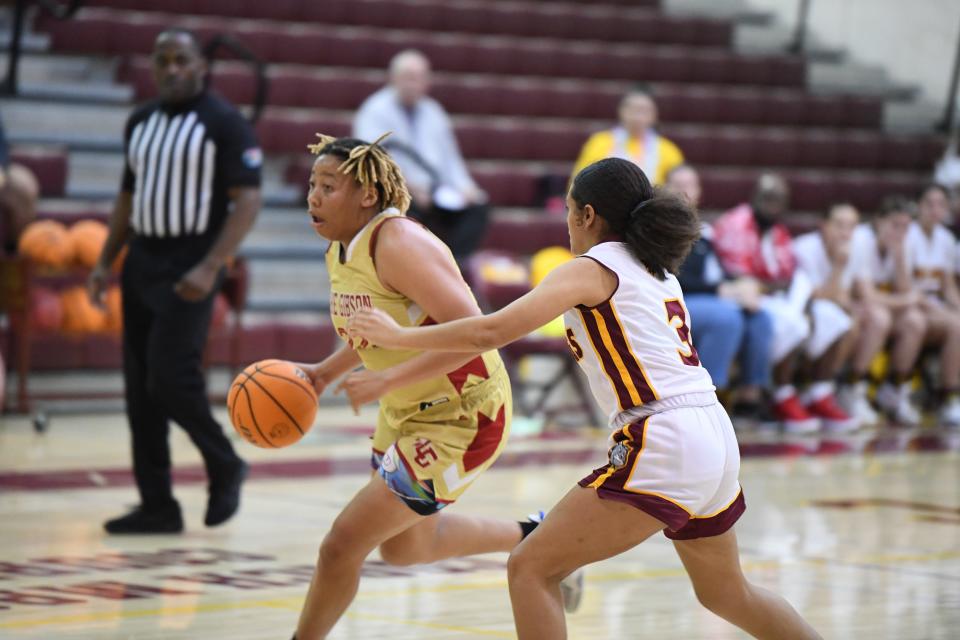 Lake Gibson small forward Samari Wilson drives hard to the rim in a contest vs. St. Cloud. She scored 13 in the district title game.