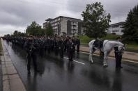 <p>Cost. Stefan Decourcey, right, leads the horse Grimsby who he co-owned with Cost. Sara Burns as they and other Fredericton police officers follow the hearses carrying Cost. Burns and Cost. Robb Costello during a regimental funeral in Fredericton on Saturday, Aug. 18, 2018. T (Photo from The Canadian Press/Darren Calabrese) </p>