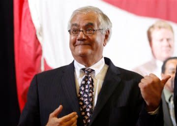 Barney Frank gestures at a campaign rally featuring Bill Clinton