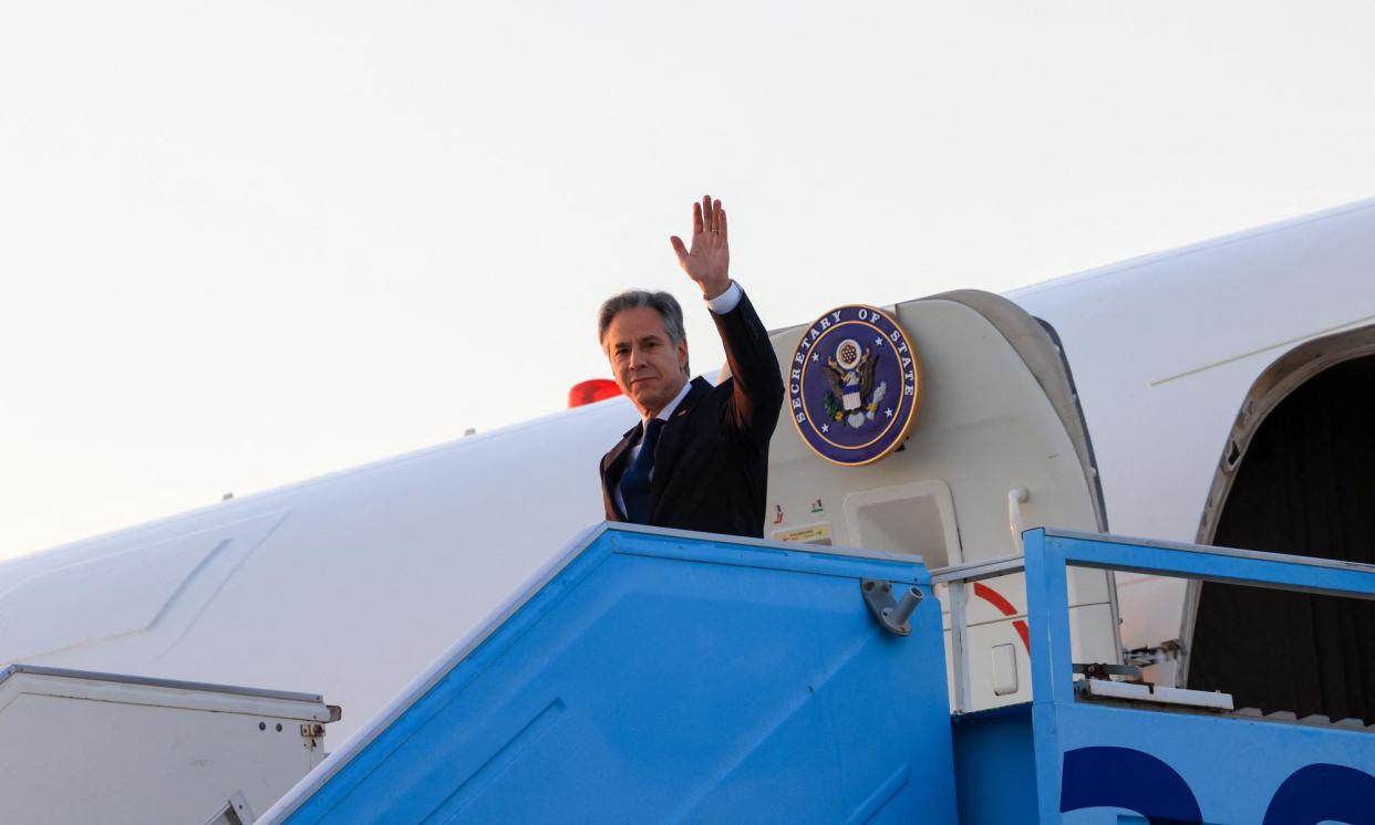 <span>Antony Blinken waves as he disembarks from his plane in Tel Aviv.</span><span>Photograph: Kevin Mohatt/AFP/Getty Images</span>