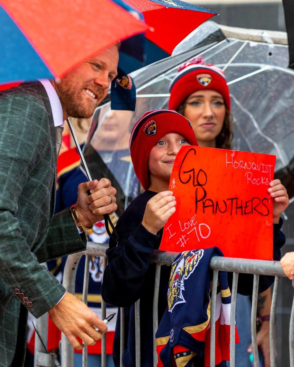 Florida Panthers right wing Patric Hornqvist (70) takes a photo with fan Noah Grizzle, 11, before the start of an NHL game against the Philadelphia Flyers at FLA Live Arena in Sunrise, Florida, on Wednesday, October 19, 2022.