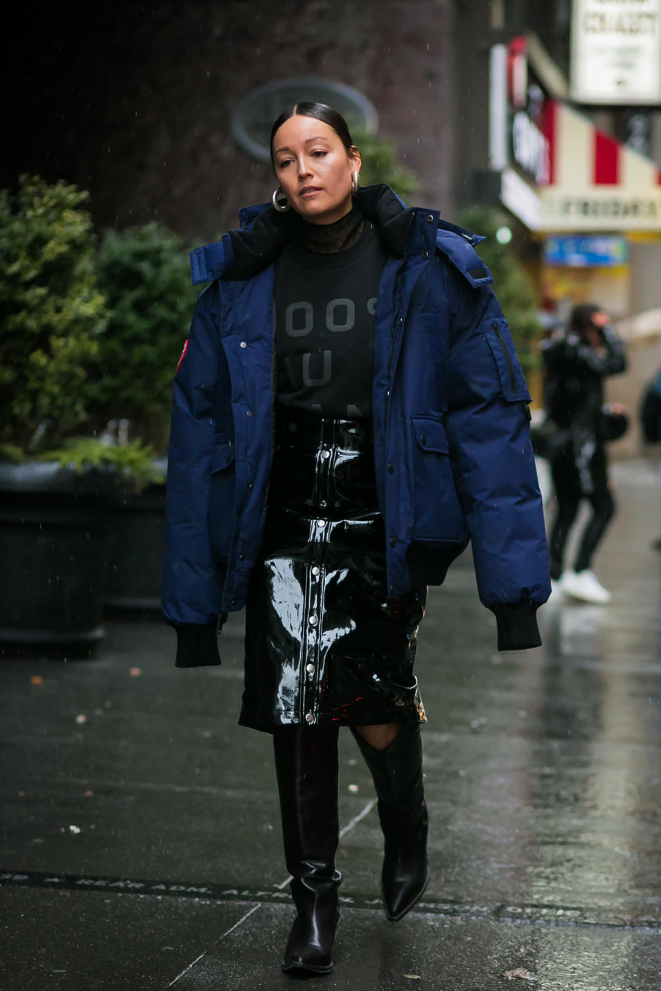 Allure editor Rachael Wang wears the very au courant oversized puffer at New York Fashion Week.