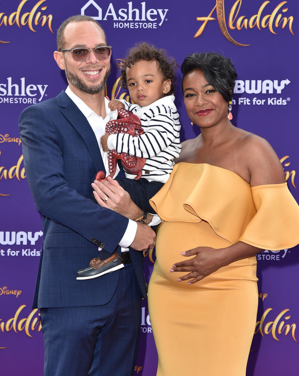 Vaughn Rasberry, Edward Aszard Rasberry and Tatyana Ali attend the premiere of Disney's "Aladdin"