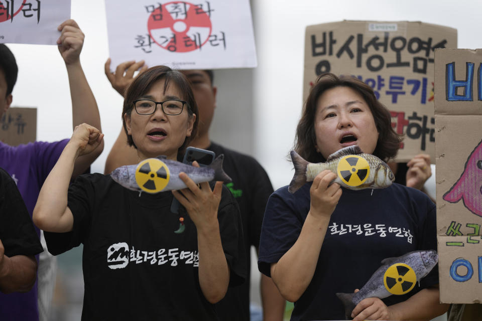 Members of an environmental group shout slogans during a rally to demand the stop of the Japanese government's decision to release treated radioactive water into the sea from the damaged Fukushima nuclear power plant, in Seoul, South Korea, Thursday, Aug. 24, 2023. (AP Photo/Lee Jin-man)