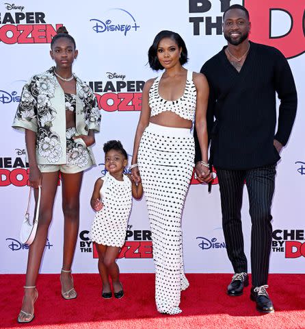 Axelle/Bauer-Griffin/FilmMagic Zaya Wade, Kaavia James Union Wade, Gabrielle Union, and Dwyane Wade attend the Premiere of Disney's "Cheaper By The Dozen" on March 16, 2022 in Los Angeles, California