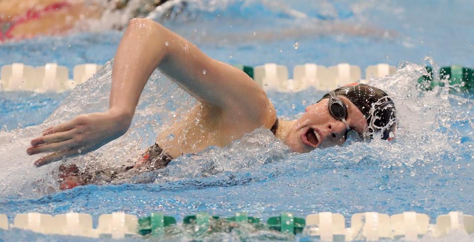 Marlington's Claire Cox competes in the girls 100 freestyle event during the Division II District Swimming and Diving Championships on Friday.