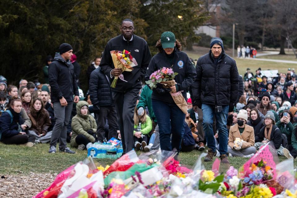 Gov. Gretchen Whitmer and Lt. Gov. Garlin Gilchrist attend a vigil at The Rock on the Michigan State University campus in East Lansing on Wednesday, Feb. 15, 2023, to honor and remember the victims of the mass shooting that happened on the MSU campus that left three dead and multiple others injured.