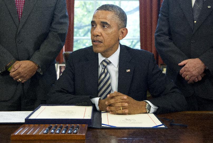 President Barack Obama speaks in the Oval Office at the White House in Washington, Monday, Aug. 6, 2012, after signing the Honoring America's Veterans and Caring for Camp Lejeune Families Act of 2012. (AP Photo/Haraz N. Ghanbari)