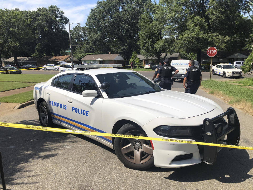 Memphis police officers work the scene of an officer-involved shooting on July 31, 2023. Police said officers shot a suspect after he attempted to enter a Jewish school with a gun and fired shots after he couldn't get into the building. / Credit: Adrian Sainz / AP