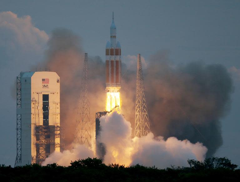 The United Launch Alliance Delta IV rocket carrying NASA's first Orion deep space exploration craft takes off from Cape Canaveral, Florida, on December 5, 2014