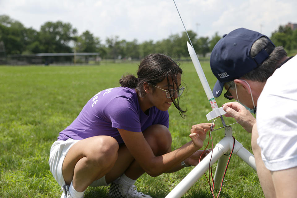 Sonali Fiorillo attaches ignition controllers to the rocket starters before launch (Marianna McMurdock)