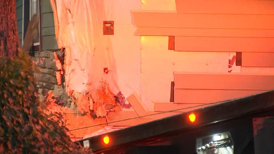 A woman was killed and her passenger has serious injuries after their car slammed into a house near Spanaway on May 4, 2023.