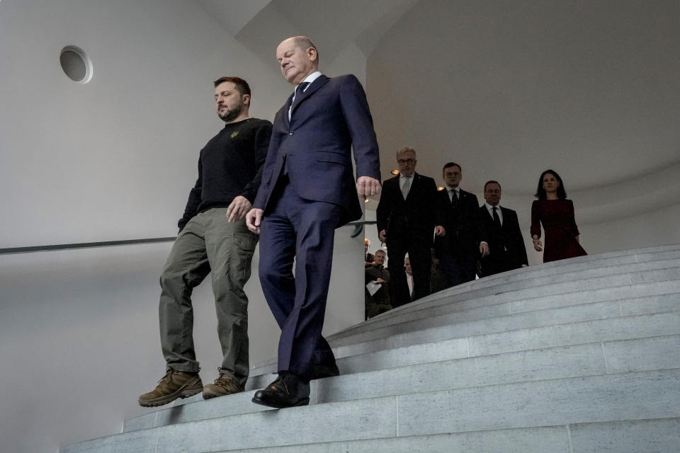 FILE - German Chancellor Olaf Scholz, right, and Ukrainian President Volodymyr Zelenskyy walk down the stairs in the chancellory during a meeting in Berlin, Friday, Feb.16, 2024. German Chancellor Olaf Scholz has emphasized his reluctance to send Taurus long-range cruise missiles to Ukraine, pointing to a risk of his country becoming directly involved in the war. Germany is now the second-biggest supplier of military aid to Ukraine after the United States and is stepping up aid to Kyiv. (AP Photo/Markus Schreiber, File)