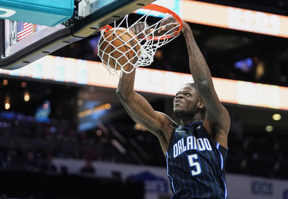 Orlando Magic center Mo Bamba (5) dunks during the first half of an NBA basketball game against the Charlotte Hornets on Thursday, April 7, 2022, in Charlotte, N.C. (AP Photo/Rusty Jones)