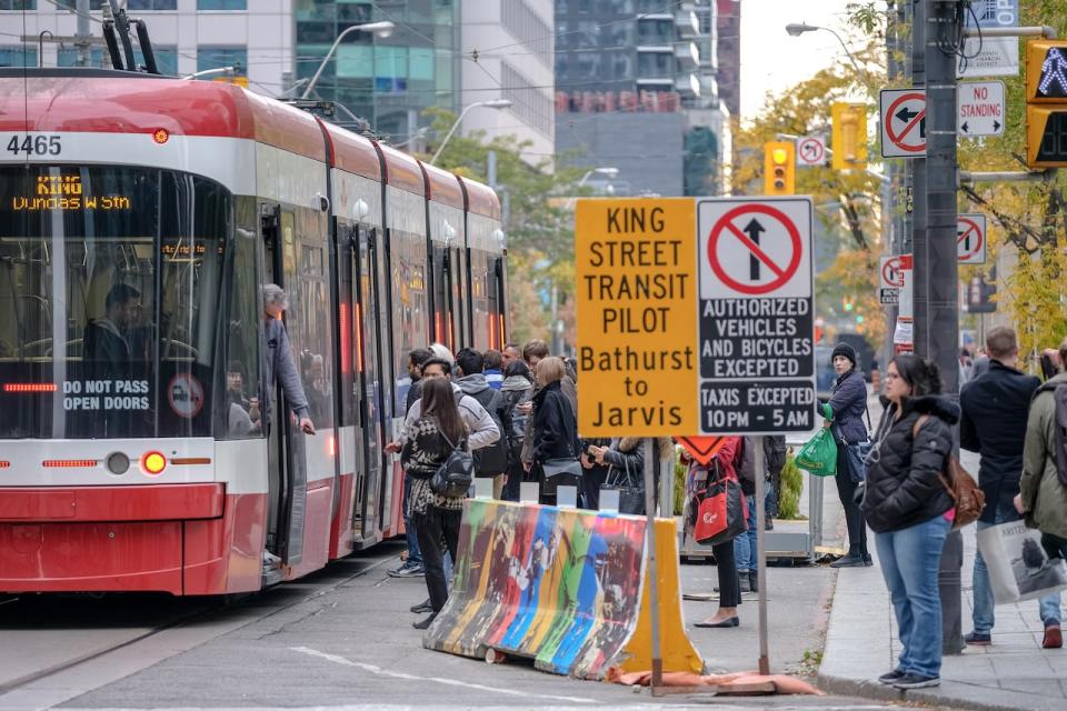 Various shots of streetcars and other TTC-related images in downtown Toronto. In this shot see sign for the King Street Transit Pilot Project and blockade at street corner. Oct 22, 2018 3:55:56 PM