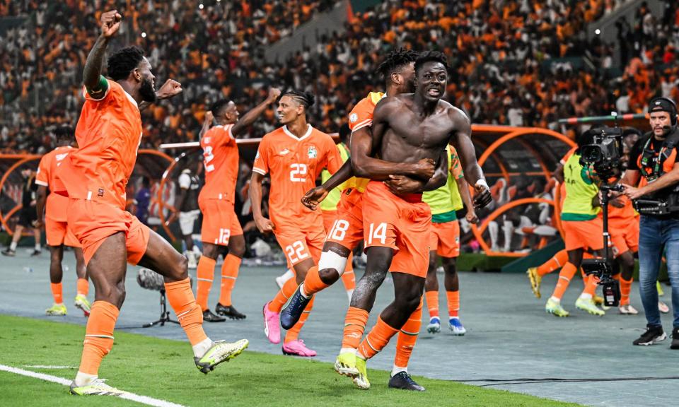 <span>Ivory Coast – caretaker manager and all – celebrate after their dramatic late goal dumped Mali out of the Africa Cup of Nations.</span><span>Photograph: Issouf Sanogo/AFP/Getty Images</span>