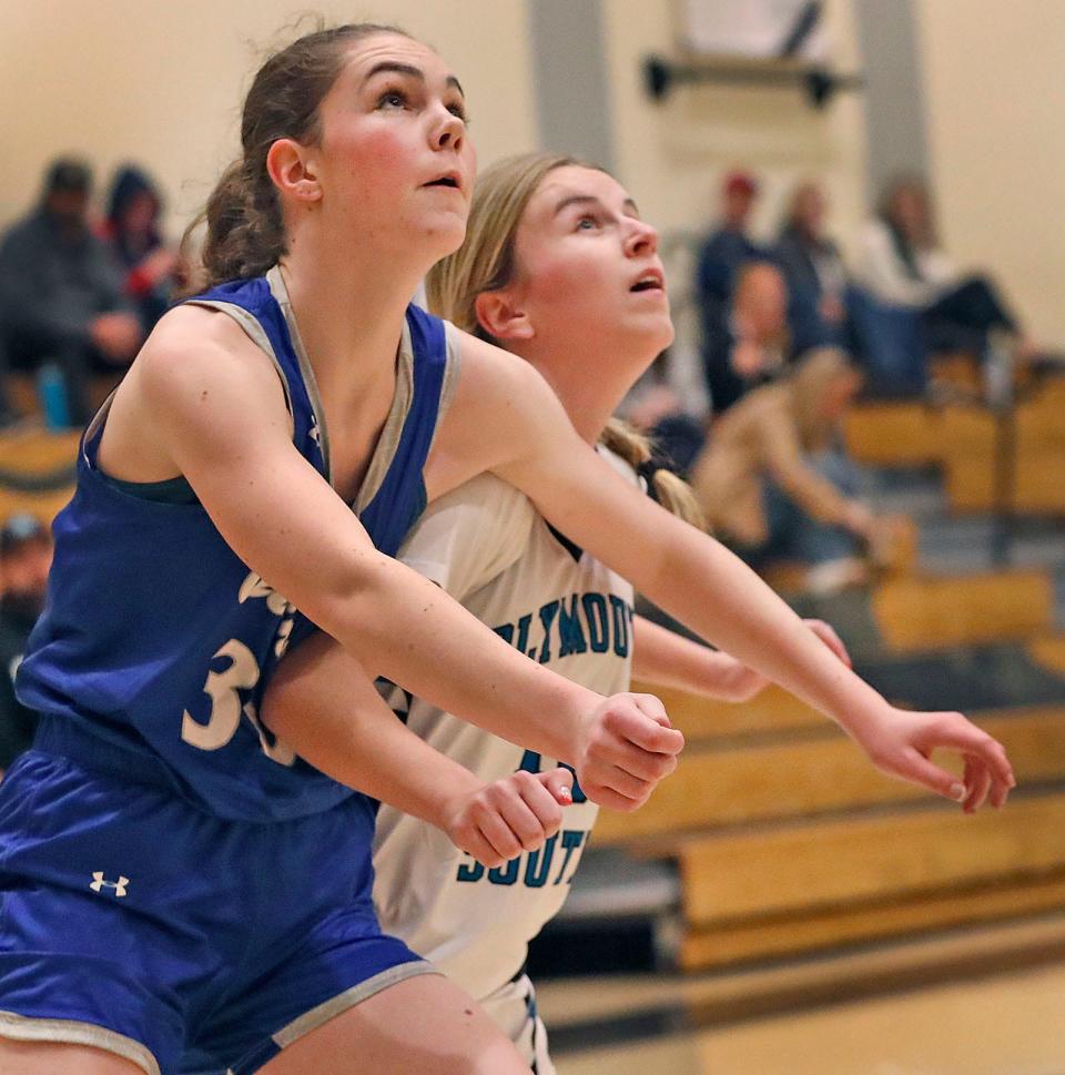 Quincy's Niamh Gendron boxes out Plymouth South's Addison Brunstrom for a free-throw rebound Friday, Dec. 15, 2023.