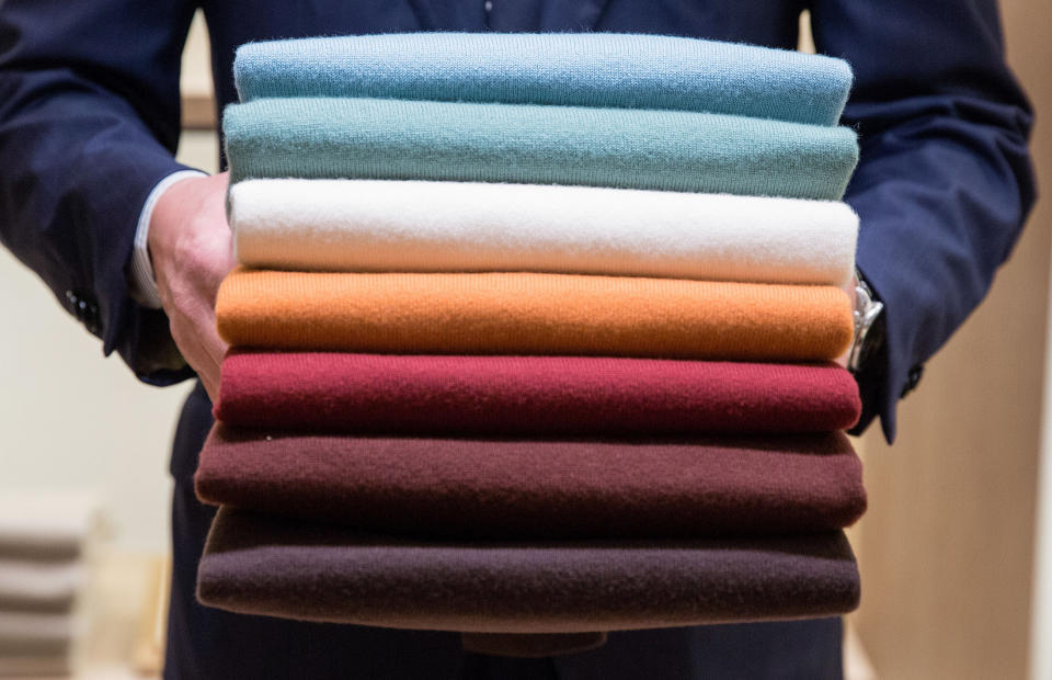 Cashmere pullovers on the move at a Loro Piana store in Milan. (Photo: Getty Images)