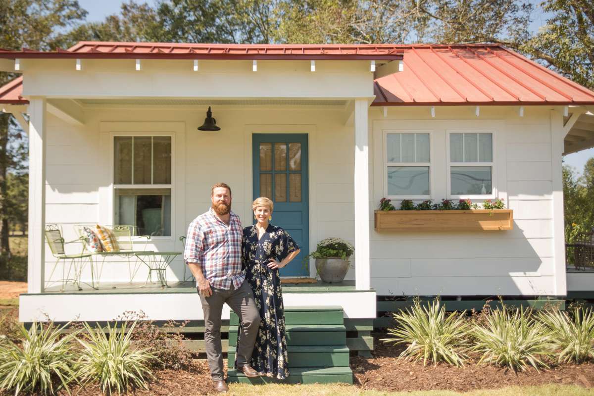 Ben and Erin Napier in front of cute home