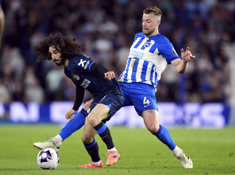 Brighton and Hove Albion's Adam Webster, right, and Chelsea's Marc Cucurella, left, challenge for the ball during the English Premier League soccer match between Brighton and Hove Albion and FC Chelsea in Brighton and Hove, England, Wednesday, May 15, 2024. (Adam Davy/PA via AP)