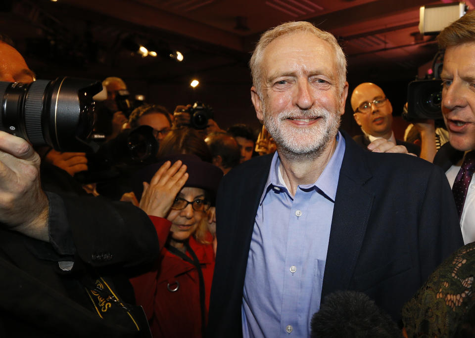 Jeremy Corbyn smiles as he leaves the stage  after he is announced as the new leader of The Labour Party during the Labour Party Leadership Conference in London, Saturday, Sept. 12, 2015. Corbyn will now lead Britain's main opposition party. (AP Photo/Kirsty Wigglesworth)