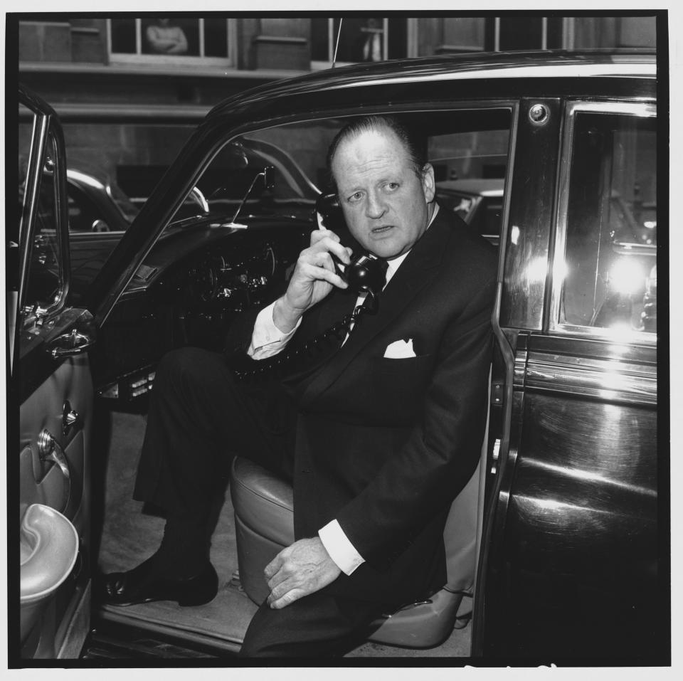 Richard Dimbleby, television broadcaster and presenter of BBC&#39;s documentary programme Panorama, uses a car radio telephone. (Photo by &#xa9; Hulton-Deutsch Collection/CORBIS/Corbis via Getty Images)
