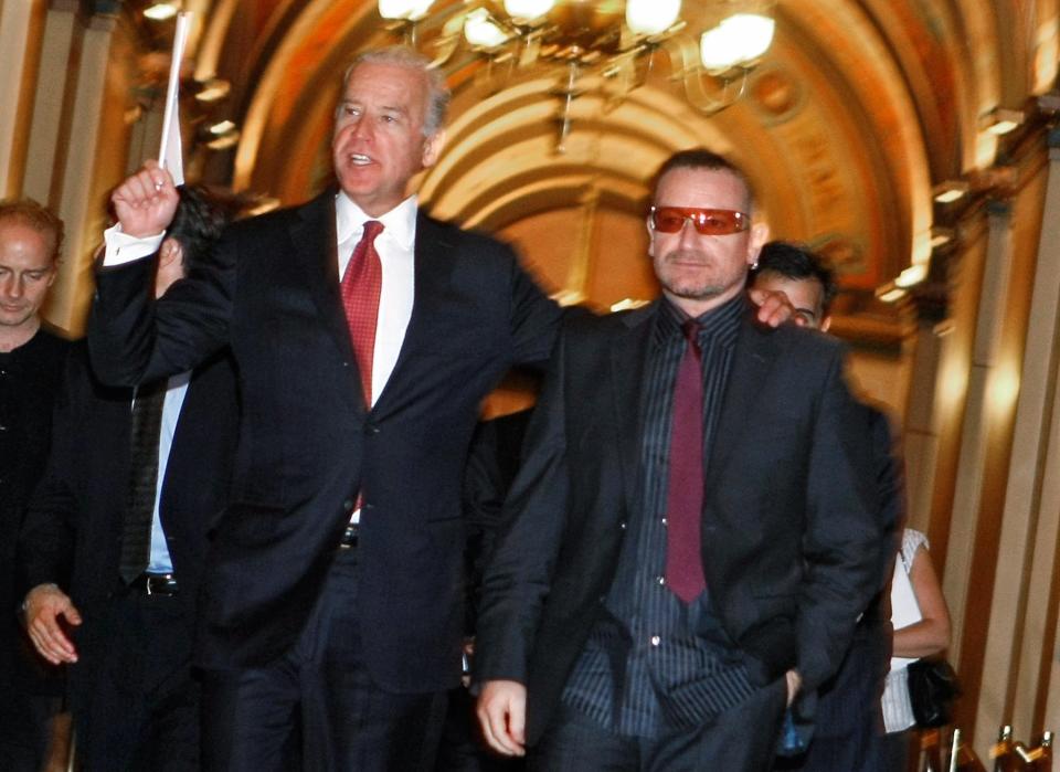 U2 frontman Bono walks with Biden to a meeting with lawmakers on Capitol Hill in Washington on Oct. 3, 2007.