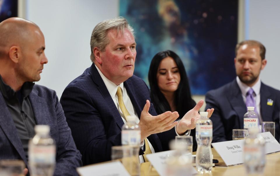 Deseret News Executive Editor Doug Wilks poses a question to U.S. Ambassador to Ukraine Bridget A. Brink during a meeting with members of the Utah trade delegation.