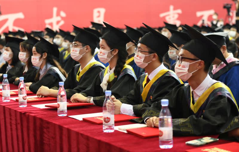 FILE PHOTO: Graduating students attend a commencement ceremony at Chongqing University of Posts and Telecommunications