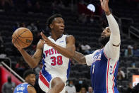 Detroit Pistons guard Saben Lee (38) looks to pass as Philadelphia 76ers center Andre Drummond (1) defends during the first half of an NBA basketball game, Friday, Oct. 15, 2021, in Detroit. (AP Photo/Carlos Osorio)