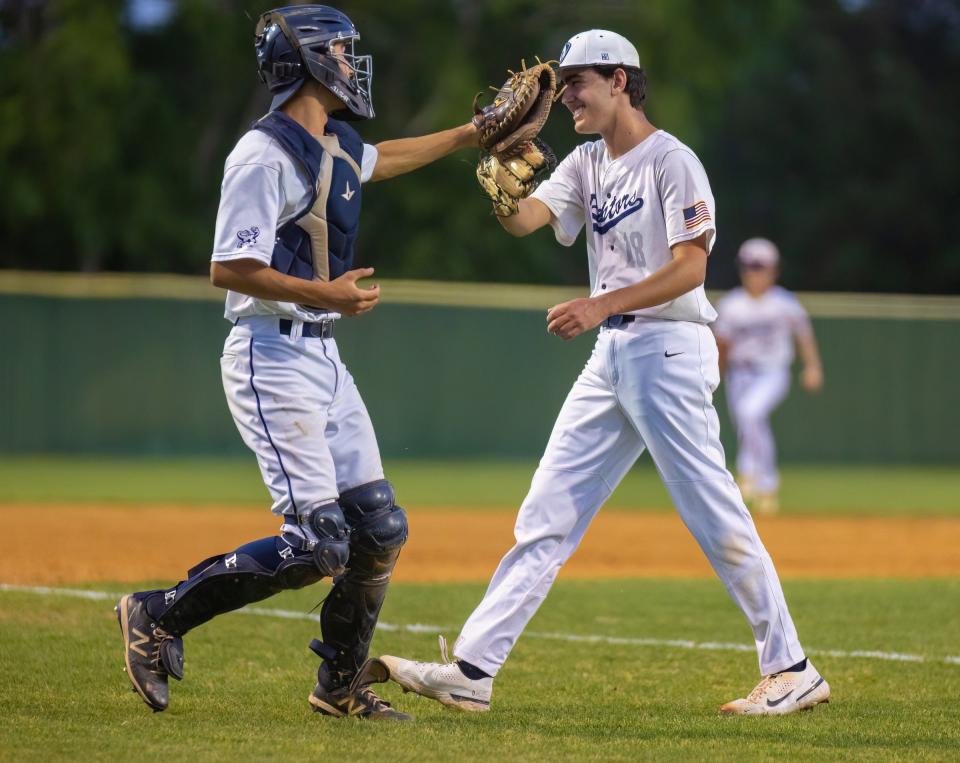 LASA catcher Major McIlvain high-fives pitcher Zac Kahn during a game against McCallum on April 10. The Raptors, with the Austin school district's newest varsity program, finished 12th in the Breazeale Cup standings.