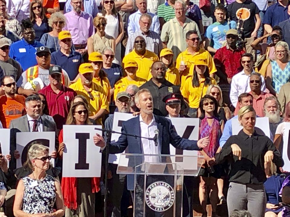 Portland, Oregon, Mayor Ted Wheeler speaks during a rally on Wednesday, Aug. 14, 2019. The mayor said anyone planning violence or espousing hatred at an upcoming weekend protest by right-wing groups in the liberal city "are not welcome here." Wheeler spoke with other city leaders ahead of the event Saturday, which is also expected to bring out anti-fascist protesters. Anticipating trouble, none of the city's nearly 1,000 police officers will have the day off Saturday. (AP Photo/Gillian Flaccus)