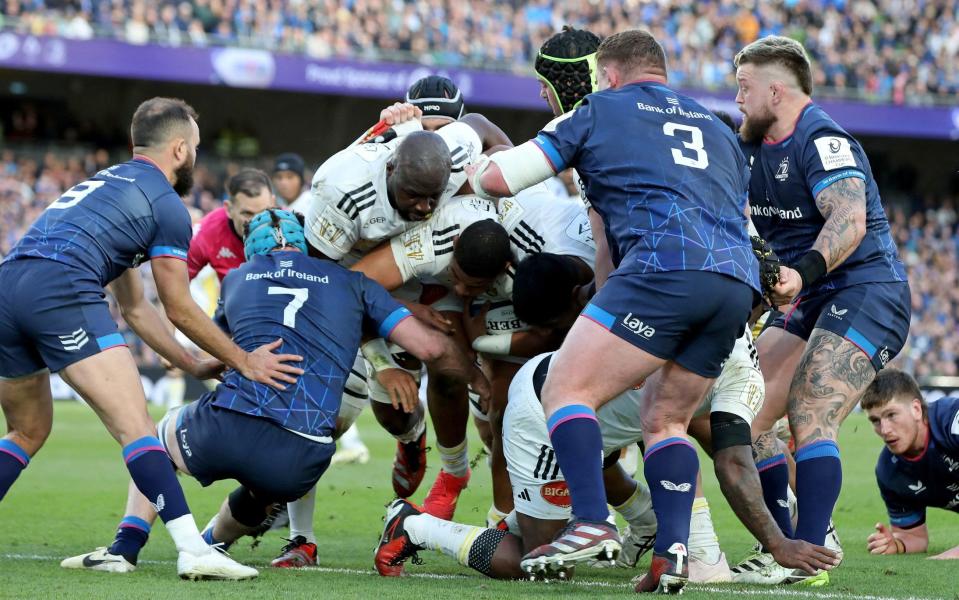 La Rochelle prop Louis Penverne (C) drives to the line to score a try amid a maul