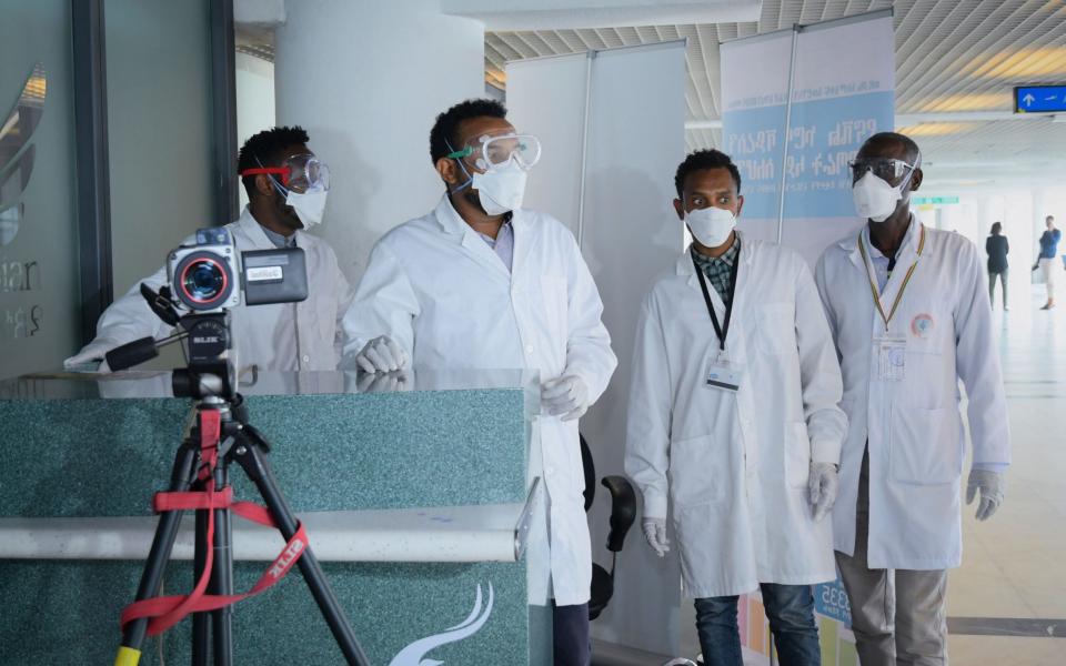 Health officials prepare for a screening for the coronavirus at Bole International Airport in Addis Ababa, Ethiopia - STR/EPA-EFE/REX