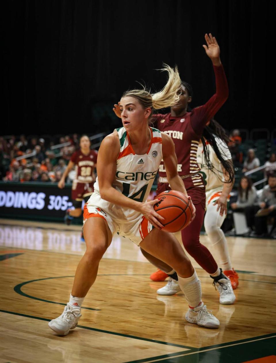 Hurricane’s Haley Cavinder (14) looks for an open teammate during the second quarter of a NCAA women’s basketball game between the University of Miami Hurricanes and Boston College on Thursday, Jan. 26, 2023, in Coral Gables. The score at half time was 41-37 with Boston ahead.