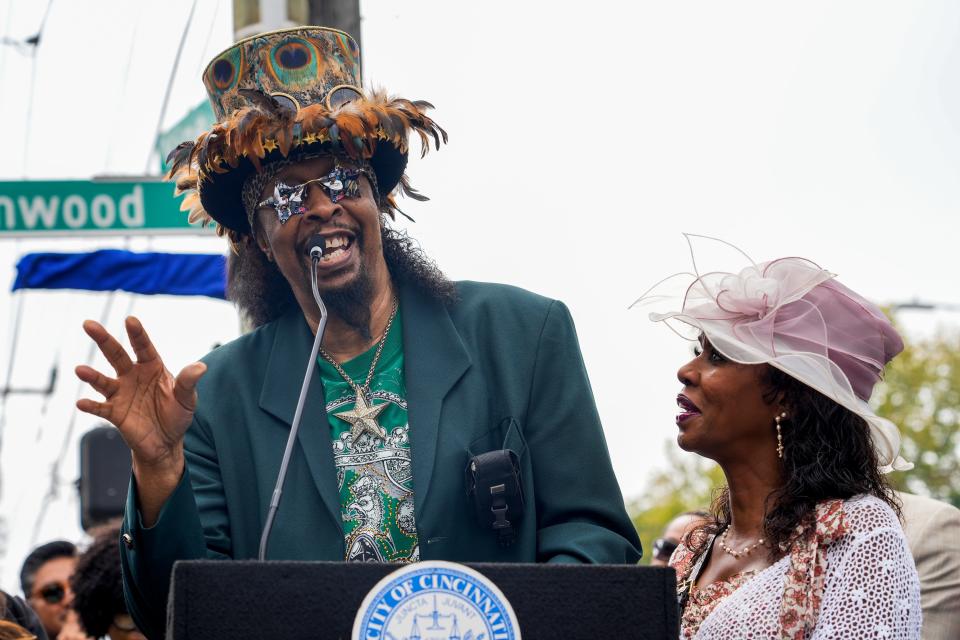 Legendary funk icon and Cincinnati native Bootsy Collins, left, reads a handwritten speech while his wife, Patti Collins, watches during a street naming ceremony in honor of Cincinnati radio personality Lincoln Ware.