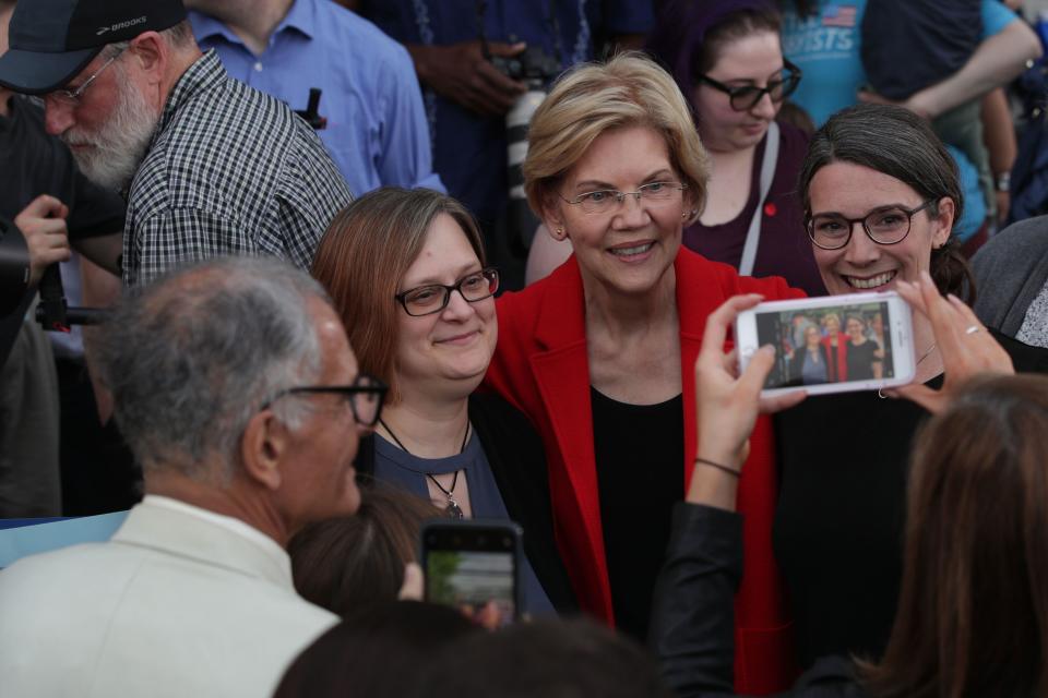 Democratic U.S. presidential hopeful Sen. Elizabeth Warren (D-MA) poses for selfies with voters after a campaign town hall at George Mason University May 16, 2019 in Fairfax, Virginia. Sen. Warren held a town hall to tell her plans for Americans and answer questions from voters.