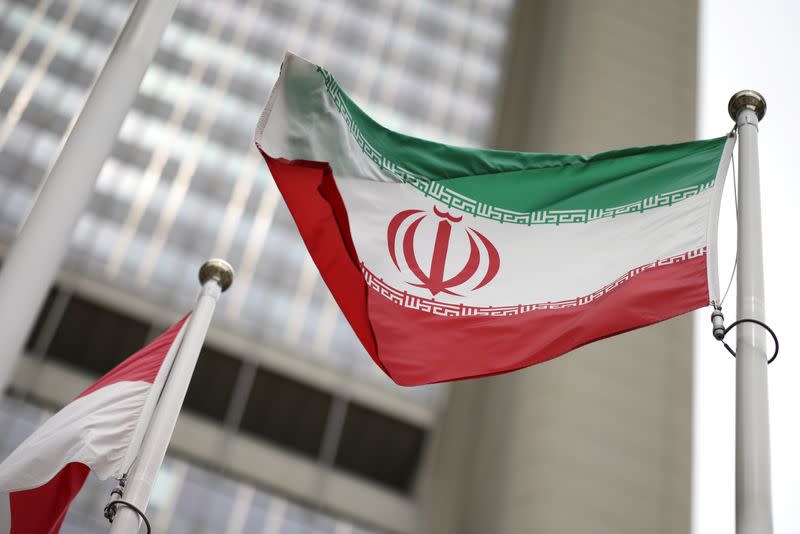 Iranian flag flies in front of the UN office building in Vienna