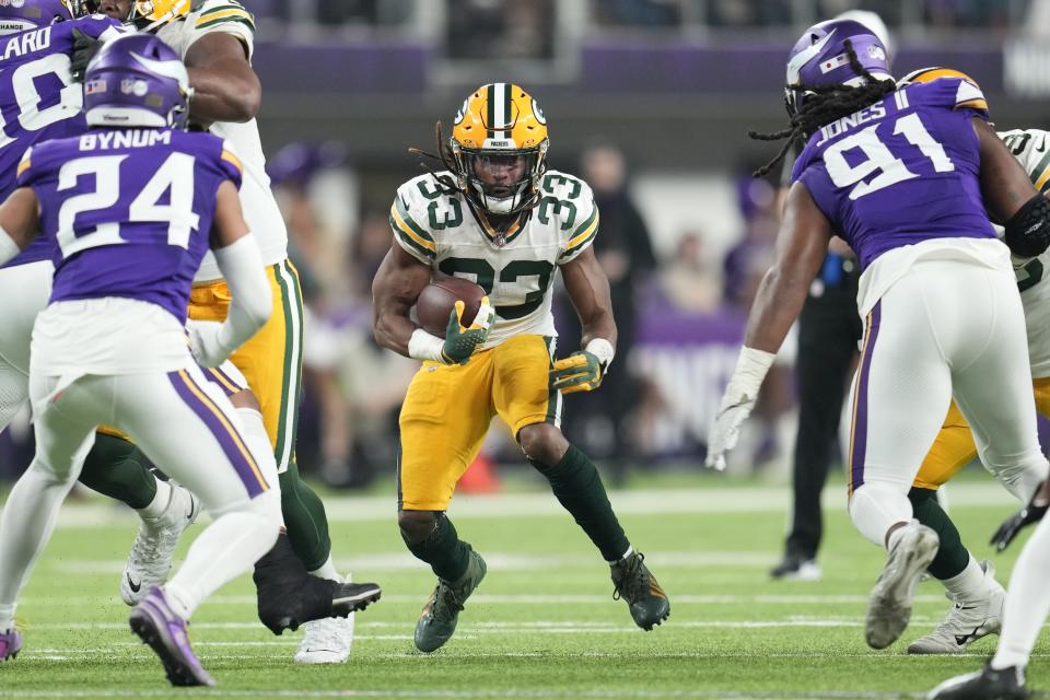 Green Bay Packers' Aaron Jones runs during the first half of an NFL football game against the Minnesota Vikings Sunday, Dec. 31, 2023, in Minneapolis. (AP Photo/Abbie Parr)