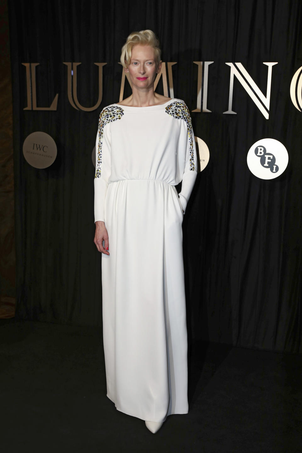 <p>Red carpet queen Tilda Swinton stood above the rest in a pure white Schiaparelli design. <i>[Photo: AP]</i> </p>