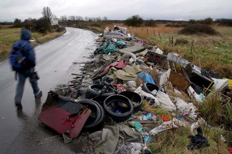 Dumped rubbish by the side of a road