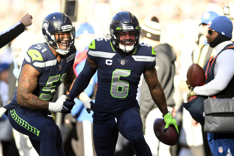 Seattle Seahawks safety Quandre Diggs (6) celebrates after intercepting a pass during the first half of an NFL football game against the Las Vegas Raiders Sunday, Nov. 27, 2022, in Seattle. (AP Photo/Caean Couto)