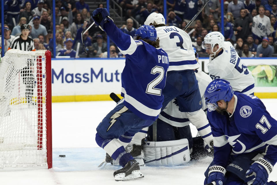 Tampa Bay Lightning center Brayden Point (21) watches his shot go in the net against the Toronto Maple Leafs during sudden-death overtime in Game 6 of an NHL hockey first-round playoff series Thursday, May 12, 2022, in Tampa, Fla. (AP Photo/Chris O'Meara)