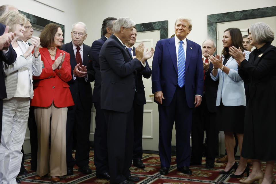 WASHINGTON, DC - JUNE 13: Republican presidential candidate, former U.S. President Donald Trump (C-R) is applauded by Senate Republicans before giving remarks to the press at the National Republican Senatorial Committee building on June 13, 2024 in Washington, DC. Trump is visiting Capitol Hill to meet with House and Senate Republicans. (Photo by Anna Moneymaker/Getty Images)