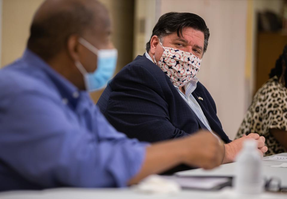 Illinois Governor JB Pritzker listens to Pastor T. Ray McJunkins during a roundtable discussion with the youth that organized the Black Lives Matter peaceful protests in downtown Springfield at Union Baptist Church, Tuesday, June 9, 2020, in Springfield, Ill.