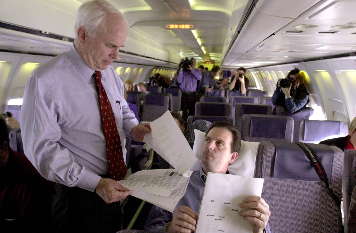 Mr Weaver with the late Sen John McCain during the latter’s presidential run. (AFP via Getty Images)