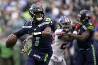 Seattle Seahawks quarterback Geno Smith passes against the New York Giants during the first half of an NFL football game in Seattle, Sunday, Oct. 30, 2022. (AP Photo/Marcio Jose Sanchez)